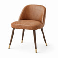 Chaise en cuir synthétique marron avec pieds en bois et finitions en laiton